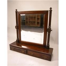 A VICTORIAN CARVED WALNUT SHAVING MIRROR