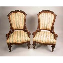 A SET OF FOUR CARVED WALNUT PARLOR CHAIRS