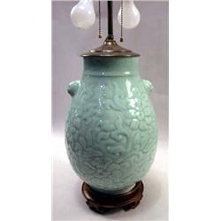 A LARGE CELADON VASE MOUNTED AS A LAMP