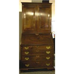 A CHIPPENDALE WALNUT SECRETARY DESK-AND-BOOKCASE