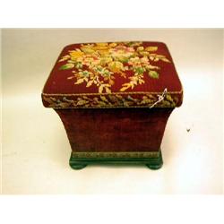 A VICTORIAN NEEDLEPINT UPHOLSTERED OTTOMAN