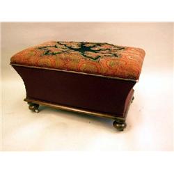 A VICTORIAN UPHOLSTERED MAHOGANY OTTOMAN