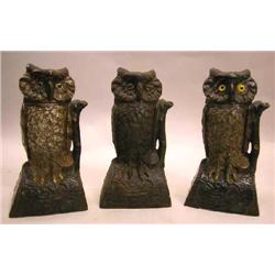 THREE CAST-IRON MECHANICAL OWL BANKS