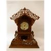 Image 1 : A WALNUT FRETWORK-DECORATED DOMED MANTLE CLOCK
