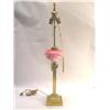 Image 1 : A BRASS COLUMNAR TABLE LAMP WITH GLASS RESERVOIR