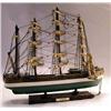 Image 1 : A GREEN AND WHITE DECORATED SAILBOAT
