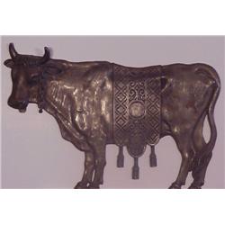 Antiqued cow relief