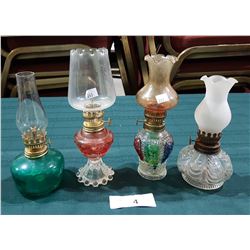 FOUR VINTAGE OIL LAMPS