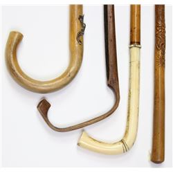 Collection of 4 walking stick canes