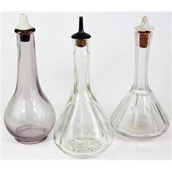 Collection of 5 antique barber bottles.
