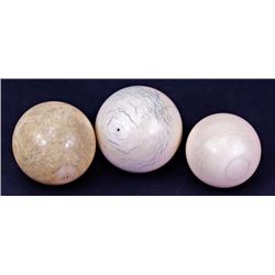 Collection of 3 antique ivory cue balls.