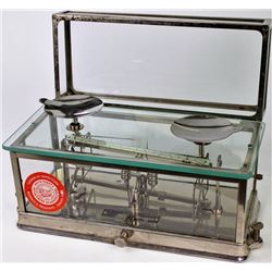 Glass and nickel cased balance scale