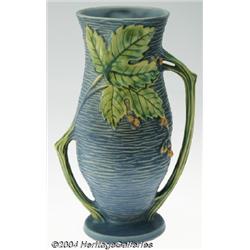 Roseville: A BUSHBERRY BLUE AMERICAN POTTERY VASE (Roseville)