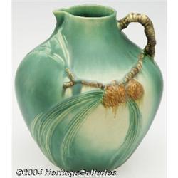 Roseville: A PINE CONE GREEN AMERICAN POTTERY BULBOUS PITCHER (Roseville)