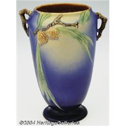 Roseville: A PINE CONE BLUE FOOTED AMERICAN POTTERY VASE (Roseville)
