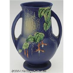 Roseville: A FUCHSIA BLUE AMERICAN POTTERY BULBOUS FOOTED VASE (Roseville)