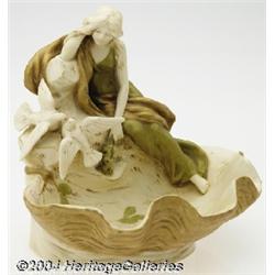Royal Dux: A CONTINENTAL PORCELAIN FIGURAL SHELL BOWL (Royal Dux)