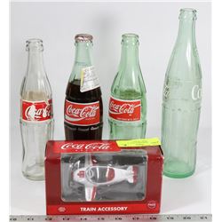 COKE MEMORABILIA INCL 4 BOTTLES AND 1 PLANE.
