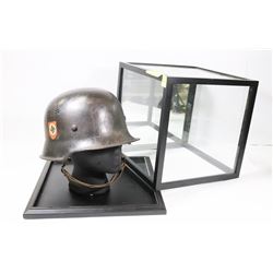 GERMAN REPLICA WWII WAR HELMET WITH DISPLAY CASE.