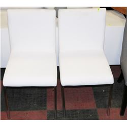 PAIR OF WHITE LEATHERETTE SIDECHAIRS