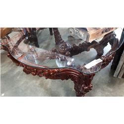 HEAVILY CARVED GLASS TOP COFFEE TABLE