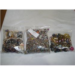 THREE BAGS OF JEWELLRY AND BEADS