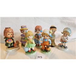 7 CHILD FIGURINES  1 figurine has broken arm