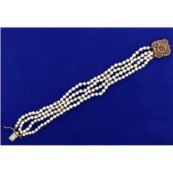 Antique 4-Strand Pearl Bracelet with Ruby and Sapphire Clasp in 14K Yellow Gold