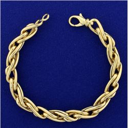 Heavy Italian Made Designer Twisting Link Bracelet in 14K Yellow Gold