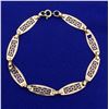 Image 1 : 7 3/4 Inch Designer Link Bracelet in 14K Yellow Gold