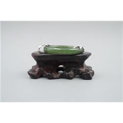 A Canada Jade Ring Pendant Inlaid with a 925 Silver Leaf.