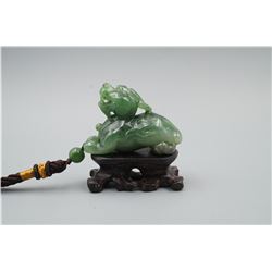 A Canada Jade "Auspicious Beast" Pattern Hand Piece.