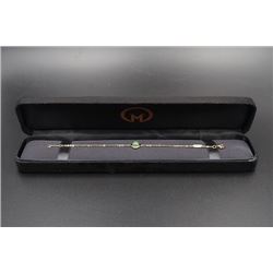 A 18K Gold Bracelet Inlaid with a Round Canada Jade.