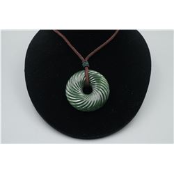 A "Spiral" Pattern Peace Buckle Pendant with String Necklace.