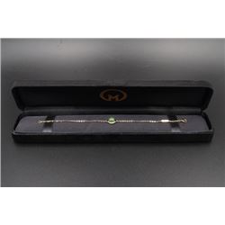A 18K Gold Bracelet Inlaid with a Round Canada Jade.