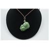Image 1 : A Canada Jade "Auspicious Beast" Pendant with String Necklace.