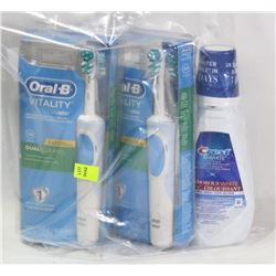 TWO ORAL B TOOTHBRUSHES SOLD WITH CREST MOUTH WASH