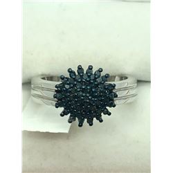 79) STERLING SILVER BLUE DIAMOND RING