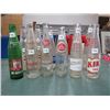 Image 1 : 12 POP BOTTLES, (2 EA, DIET RITE, MISSION, STUBBY, DREWERS (1 W/RCMP), 1 EA KIK, ROYAL CROWN, DOUBLE