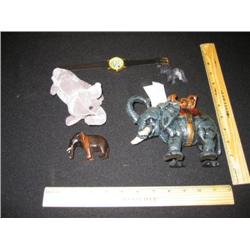 This is an interesting group, we have an elephant wrist watch, and a plush elephant toy, a black ony