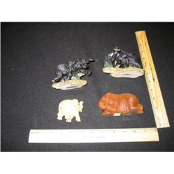 Four very nice wood carved elephants, two depict elephant family life, while the other two are very 
