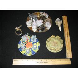 This menagerie is very eclectic. We find little miniature ceramic elephants, some are pewter or gold