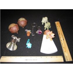 Two sets of elephant salt and pepper shakers, one onyx and one is ceramic. The ceramic items are the