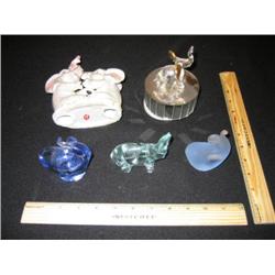 Five elephants, 3 are blown glass in a "modern" style. The single glass elephant is blow glass with 