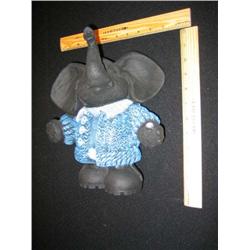 This very large elephant is happy displaying his cardigan.