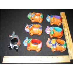 These seven elephant are napkin rings from Mexico, hand painted and colorful.