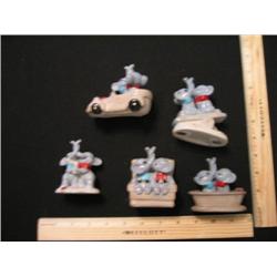 This set of five elephants are all doing there "thing" look at their activities.