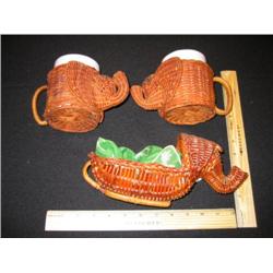 A three piece wicker elephant breakfast set, including the mugs. This has an elephant bread basket a
