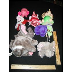 These seven toy elephants are varied, the large one will trumpet when squezed. The pink elephant wil