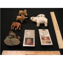 Seven elephants, two are picture frames, two are a set, one little guy is staring into his reflectio